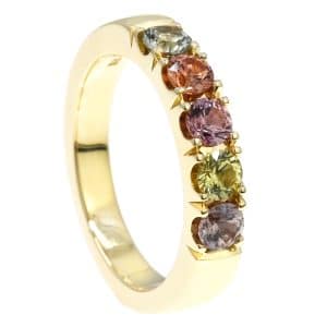 Rainbow sapphires in gold ring