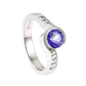 White metal twist ring with tanzanite