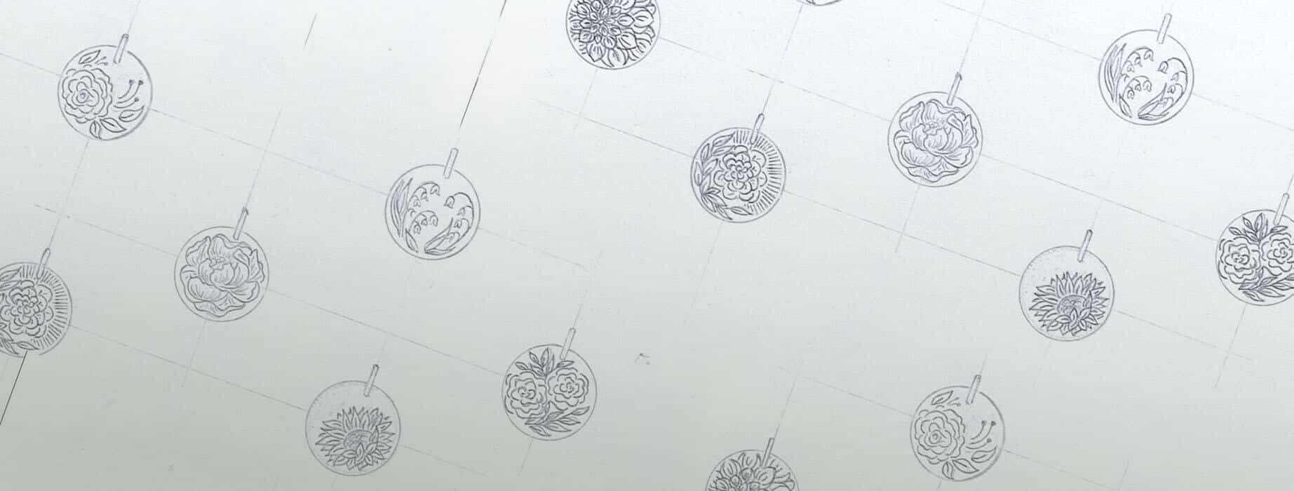 Sketches of dress jewellery with a flower pendant