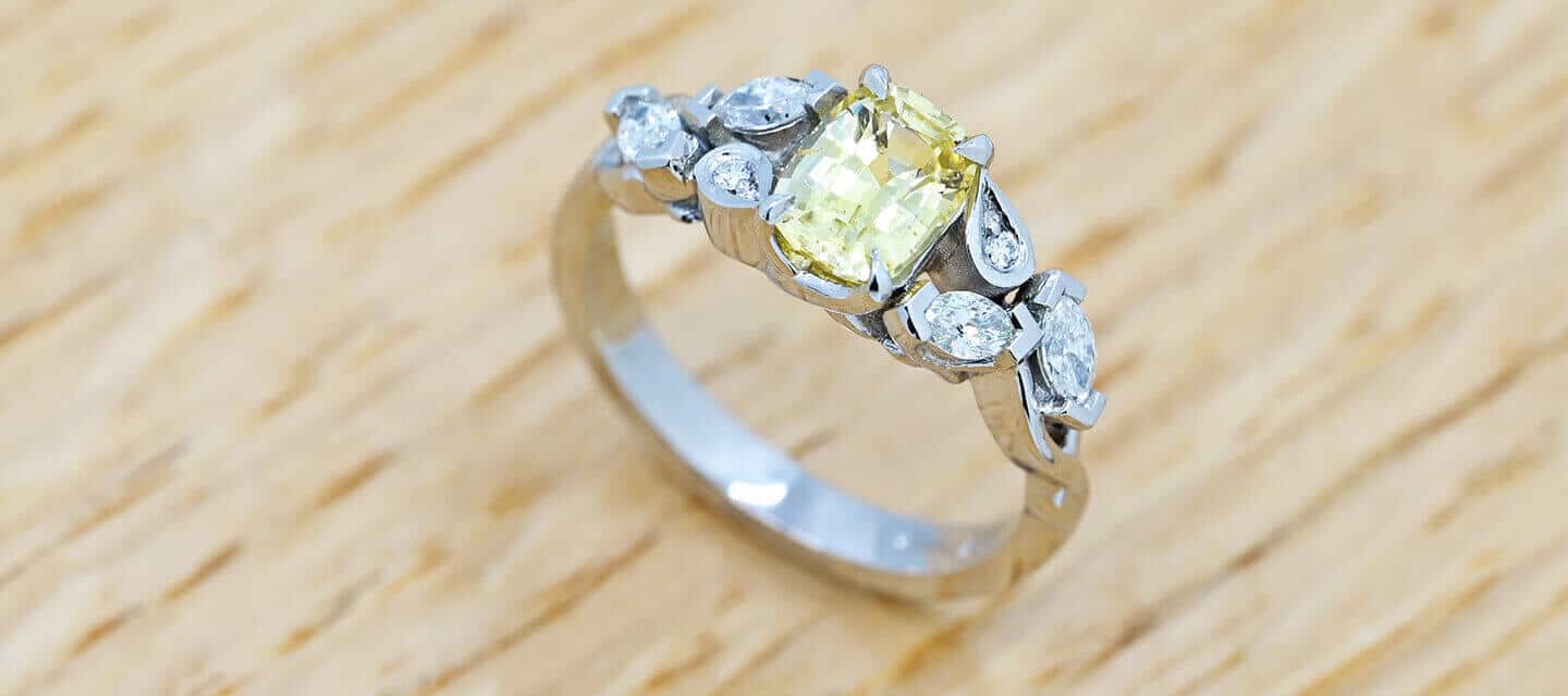 Yellow sapphire and diamond ring