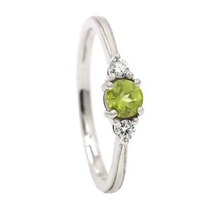 White gold peridot and diamond trilogy ring