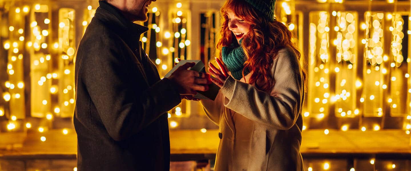 Couple giving a gift box