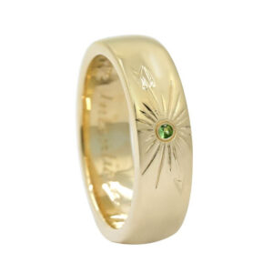 gold wedding ring with gemstone