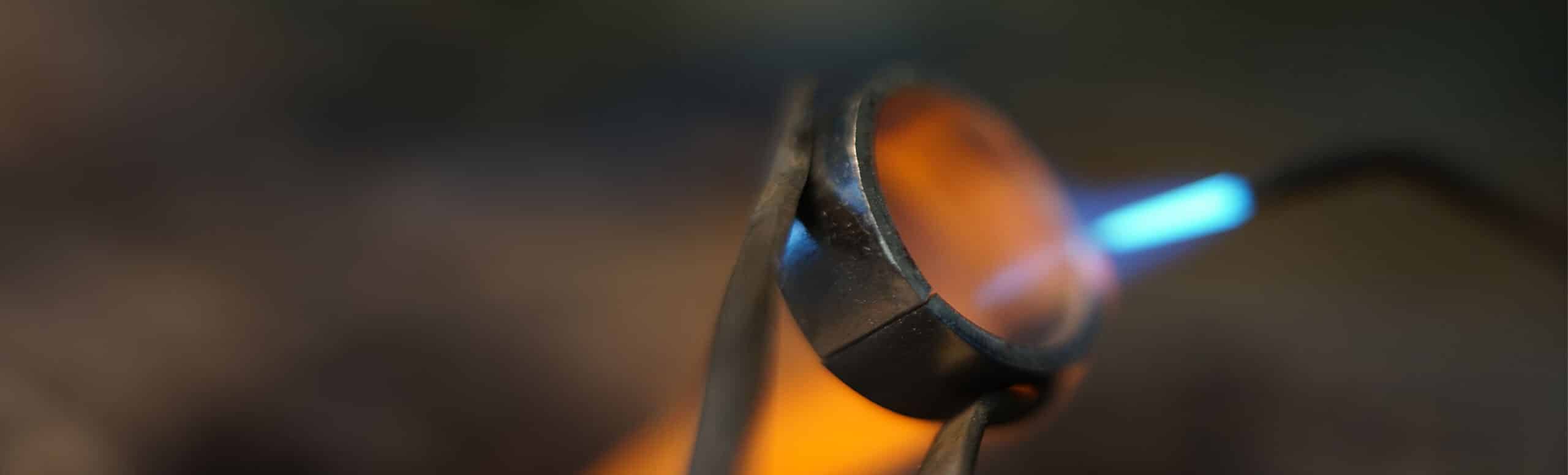 wedding ring and flame in workshop